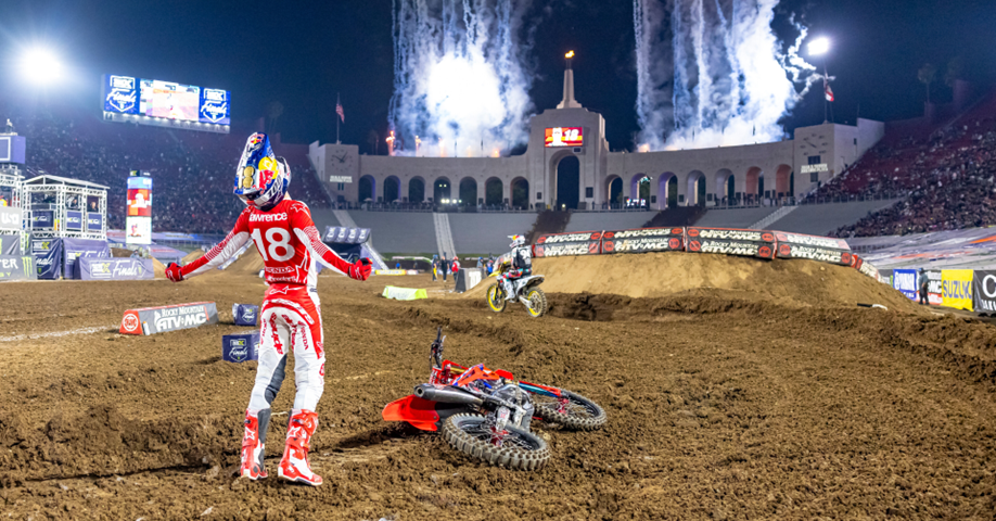 Jett Lawrence celebrates after winning the first-ever SuperMotocross World Championship at the Los Angeles Memorial Coliseum. Photo Credit: Octopi Media  
