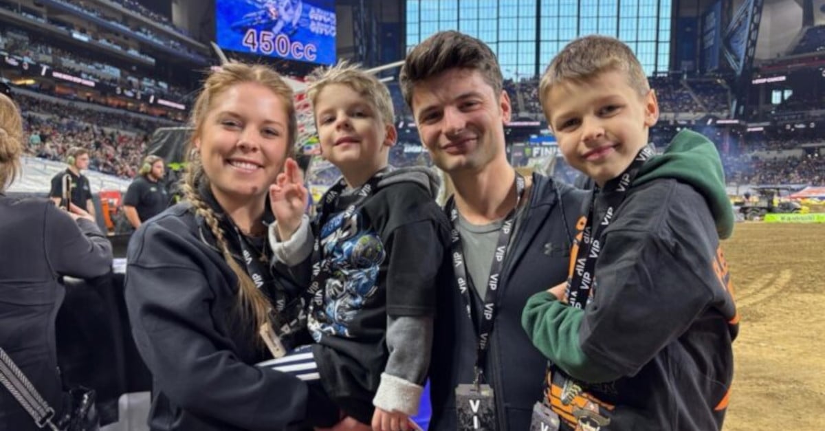 Family of four trackside at a Monster Energy Supercross race