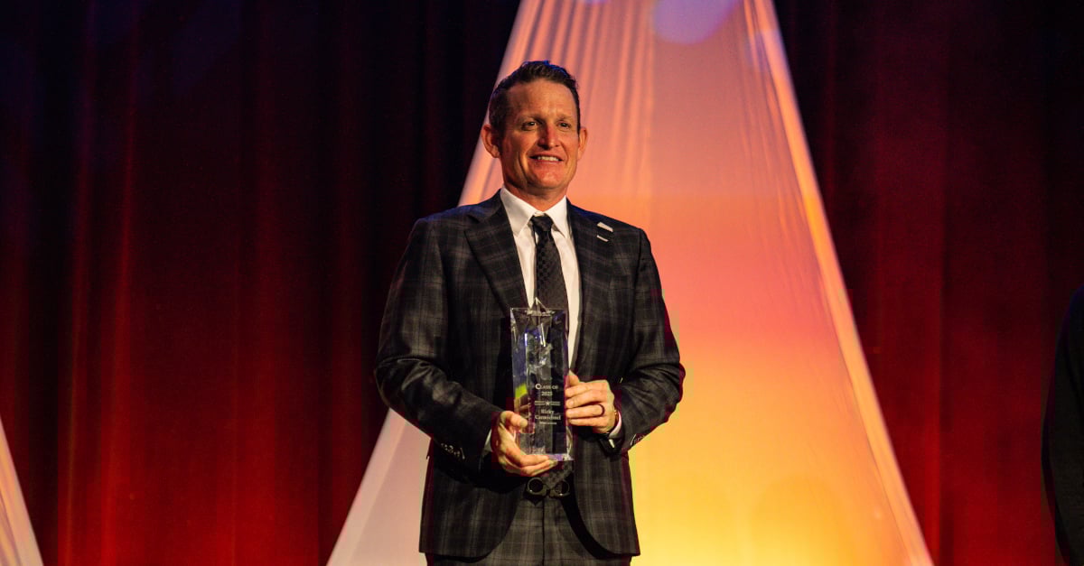 Ricky Carmichael on stage with his award
