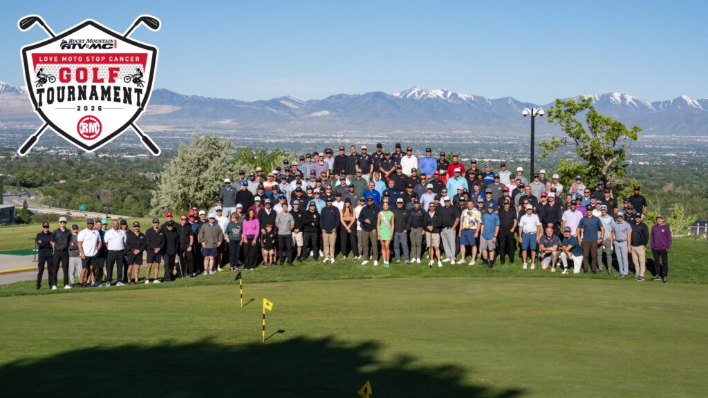 Crowd of people with Rocky Mountain ATV MC Love Moto Stop Cancer Golf Tournament logo