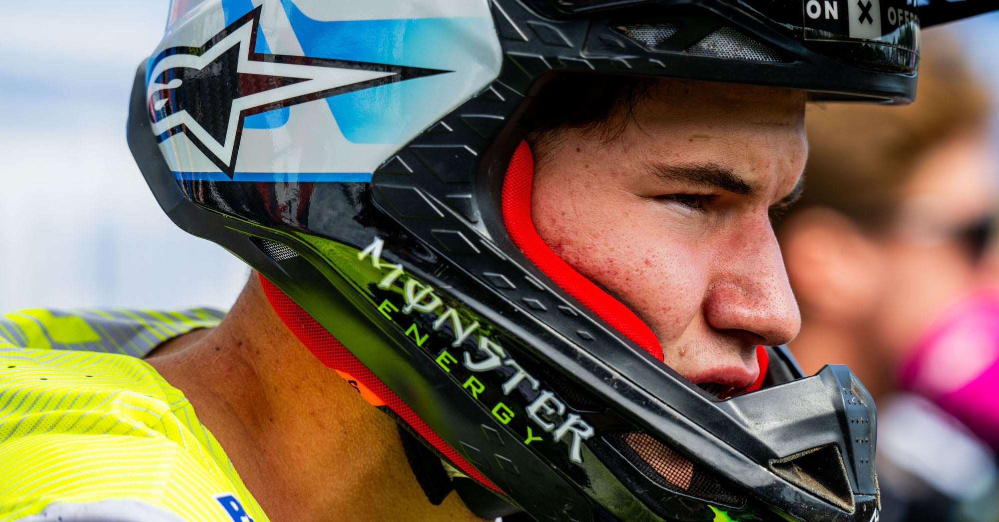 Close up of a Pro MX rider watching on through his helmet