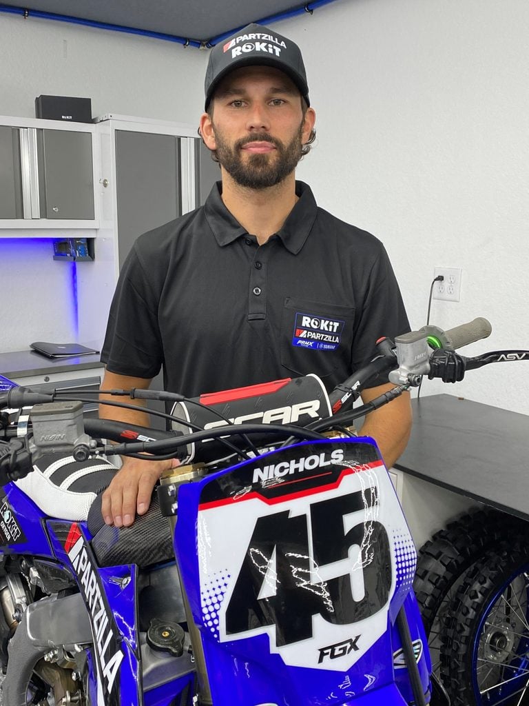 Colt Nichols poses with his Yamaha motorcycle